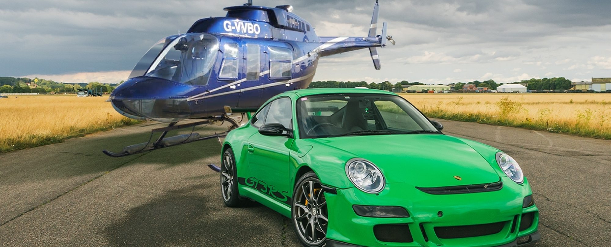 Green sports car & helicopter