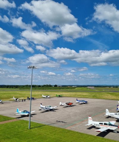 Aircrafts parked on a concrete apron at a regional airport