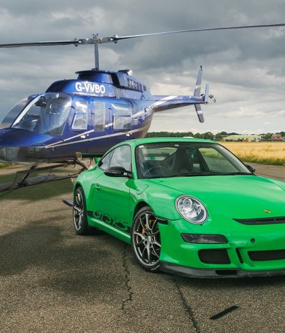 Green sports car & helicopter